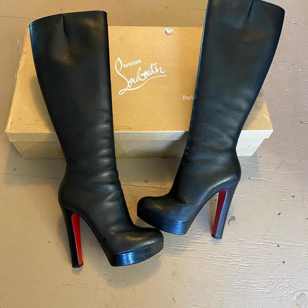Christian Louboutin knee high black leather boots.